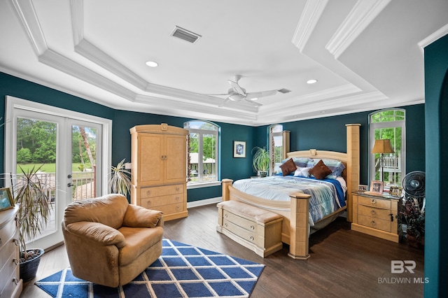 bedroom with a raised ceiling, access to outside, wood finished floors, crown molding, and a ceiling fan