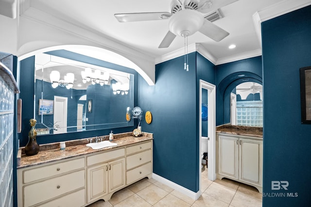 full bathroom with ceiling fan, tile patterned floors, vanity, crown molding, and baseboards