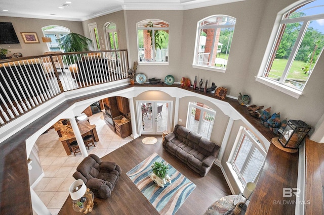 living room featuring french doors, ornamental molding, tile patterned floors, and recessed lighting