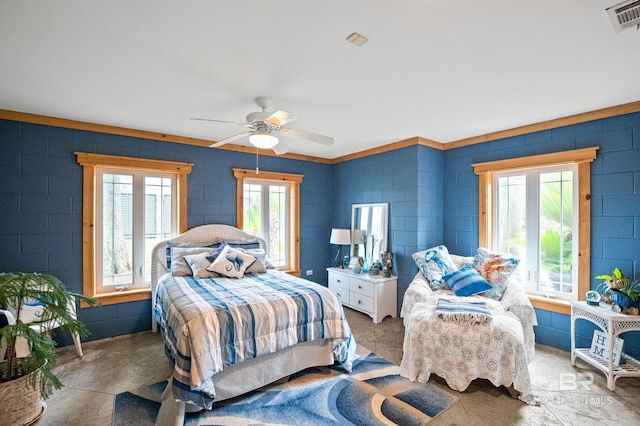 bedroom with concrete floors and ceiling fan