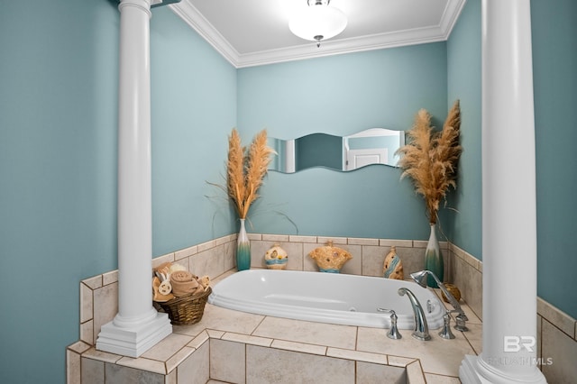 bathroom with decorative columns, ornamental molding, and a bath