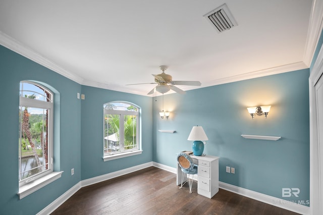 unfurnished office featuring crown molding, baseboards, dark wood finished floors, and a ceiling fan
