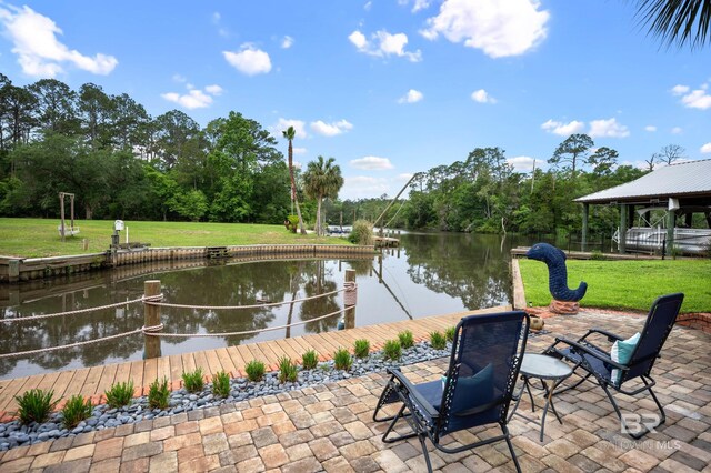 view of patio featuring a water view, a dock, and view of scattered trees