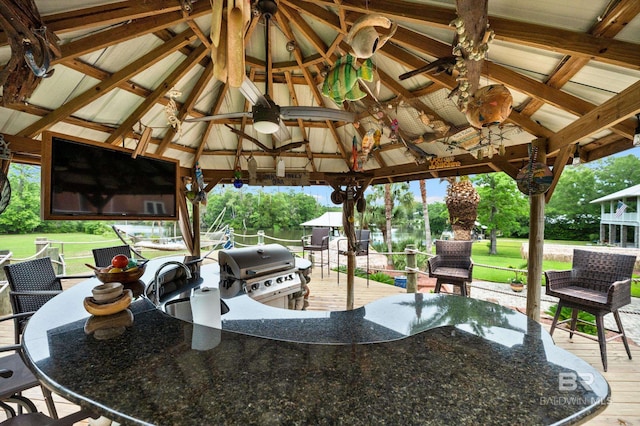 view of patio / terrace featuring a gazebo, area for grilling, a ceiling fan, and a wooden deck