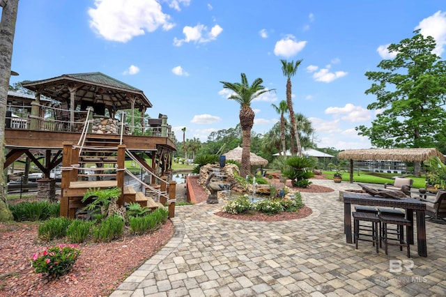 view of patio / terrace with a gazebo and stairway