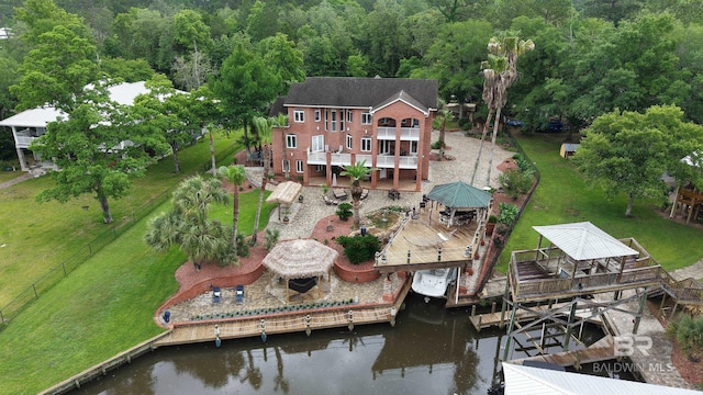 aerial view of property and surrounding area with a nearby body of water