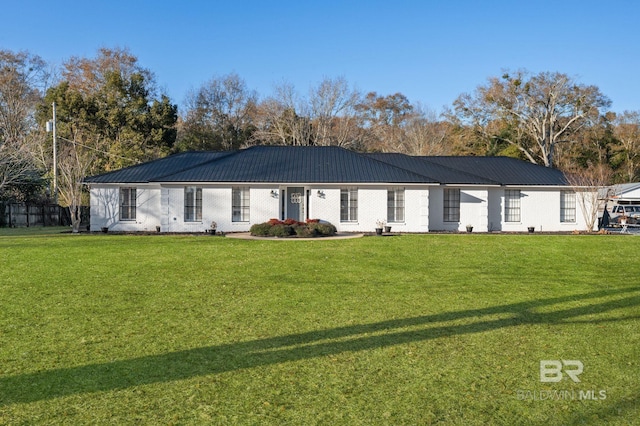 ranch-style home with a front lawn