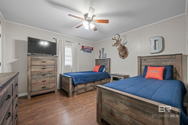 bedroom with ornamental molding, dark hardwood / wood-style flooring, and ceiling fan