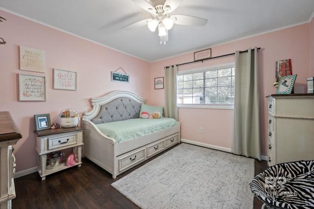 bedroom with dark hardwood / wood-style flooring, ornamental molding, and ceiling fan