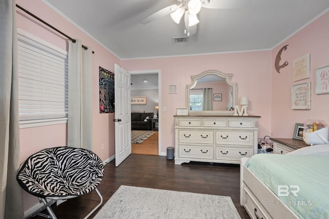 bedroom featuring crown molding, ceiling fan, and dark wood-type flooring