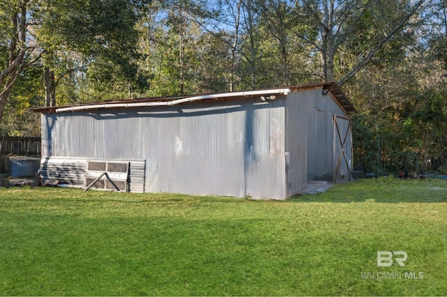 view of outdoor structure with a yard