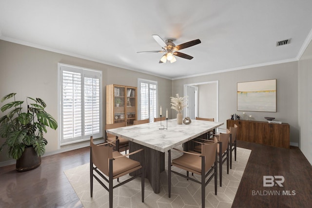 dining area featuring ceiling fan, ornamental molding, and wood-type flooring