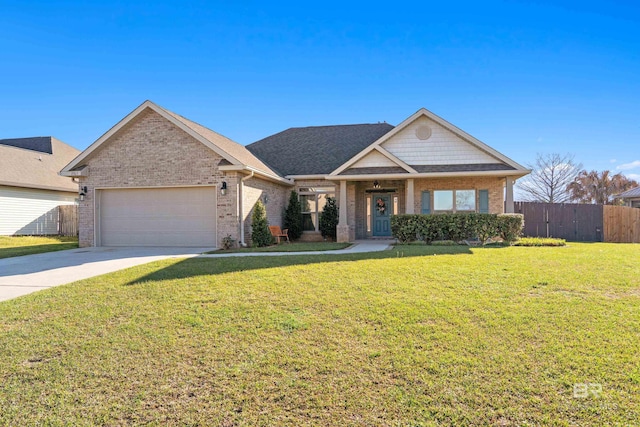 17163 Feder Dr, Foley, AL 36535 - view of front of property with fence, driveway, a front lawn, brick siding, and a garage