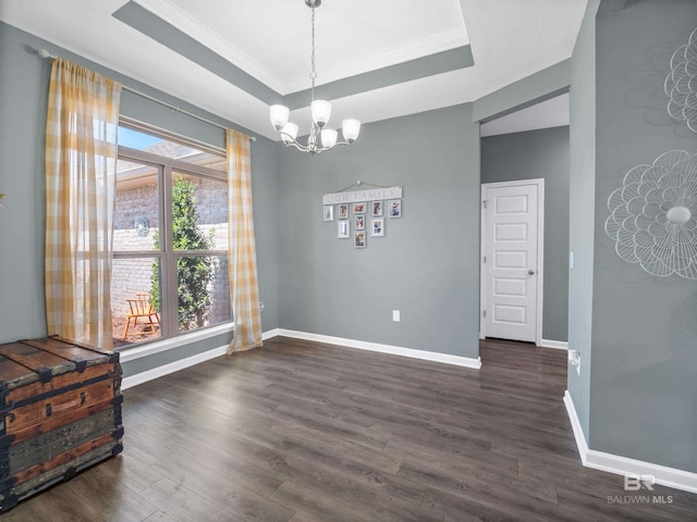 17163 Feder Dr, Foley, AL 36535 - dining space with a tray ceiling, ornamental molding, baseboards, dark wood-style floors, and a notable chandelier