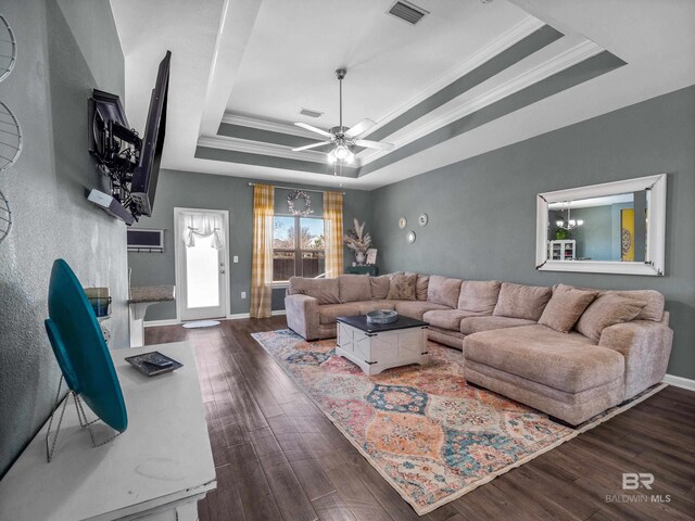 17163 Feder Dr, Foley, AL 36535 - living area with a tray ceiling, crown molding, a ceiling fan, dark wood finished floors, and visible vents
