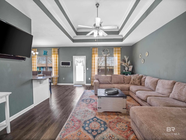 17163 Feder Dr, Foley, AL 36535 - living area with a raised ceiling, baseboards, ceiling fan with notable chandelier, ornamental molding, and dark wood-style flooring