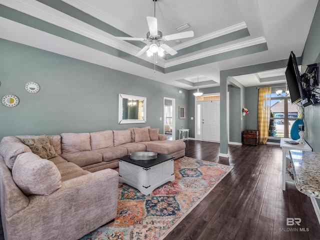 17163 Feder Dr, Foley, AL 36535 - living room with crown molding, baseboards, a raised ceiling, dark wood-style floors, and visible vents