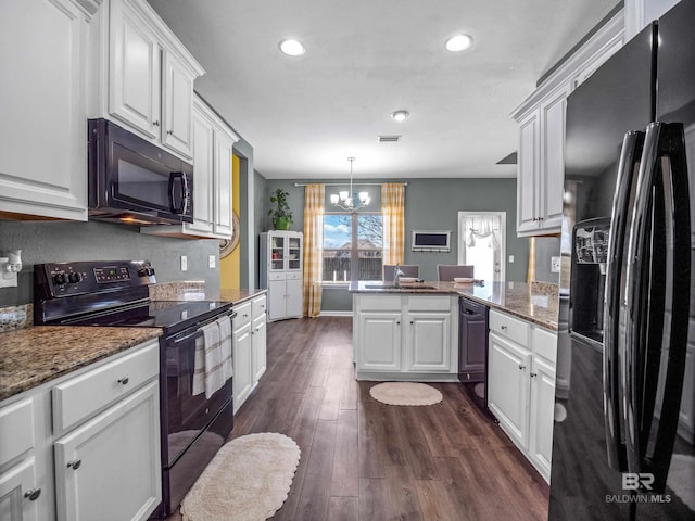 17163 Feder Dr, Foley, AL 36535 - kitchen featuring a notable chandelier, black appliances, a peninsula, and white cabinets