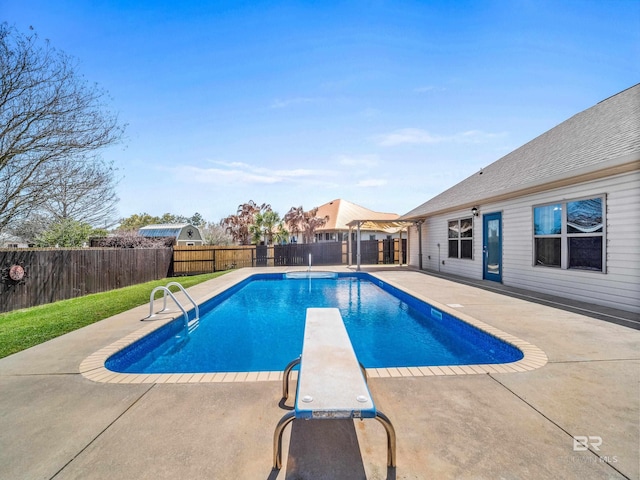 17163 Feder Dr, Foley, AL 36535 - view of swimming pool featuring a diving board, a fenced backyard, a fenced in pool, and a patio