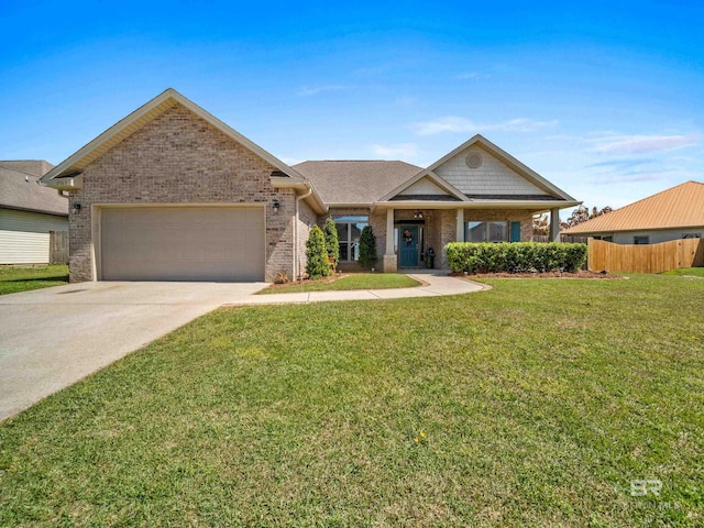 17163 Feder Dr, Foley, AL 36535 - view of front of house featuring driveway, a front yard, fence, brick siding, and a garage