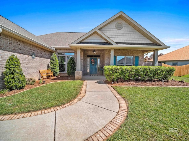 17163 Feder Dr, Foley, AL 36535 - view of front facade with brick siding, a shingled roof, and a front lawn