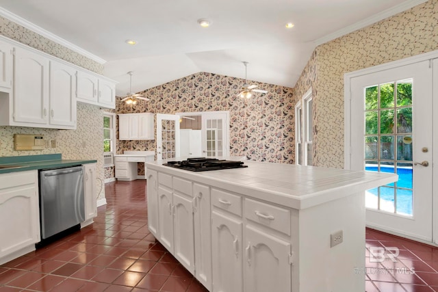 6805 Hunters Ct, Mobile, AL 36695 - kitchen with stainless steel dishwasher, dark tile patterned flooring, vaulted ceiling, black gas stovetop, and wallpapered walls