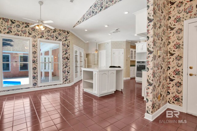 6805 Hunters Ct, Mobile, AL 36695 - kitchen with wallpapered walls, baseboards, oven, ceiling fan, and ornamental molding