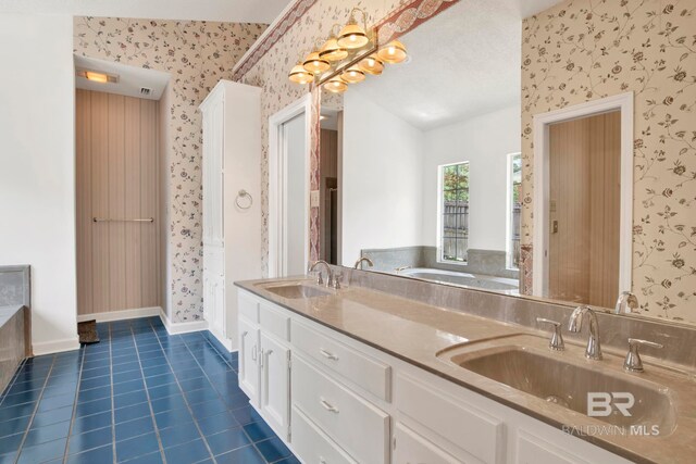 6805 Hunters Ct, Mobile, AL 36695 - full bathroom with wallpapered walls, double vanity, a garden tub, tile patterned flooring, and baseboards