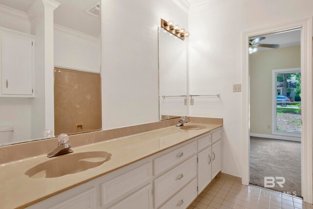 6805 Hunters Ct, Mobile, AL 36695 - full bathroom with double vanity, tile patterned floors, crown molding, ceiling fan, and baseboards