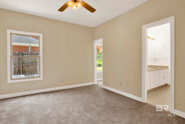 6805 Hunters Ct, Mobile, AL 36695 - empty room featuring carpet floors, ceiling fan, and baseboards