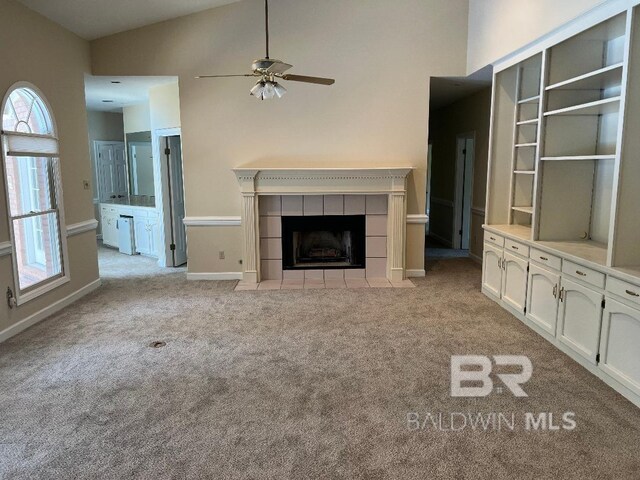 6805 Hunters Ct, Mobile, AL 36695 - unfurnished living room with light carpet, a ceiling fan, healthy amount of natural light, a fireplace, and high vaulted ceiling