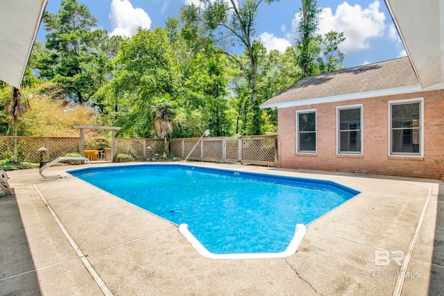 6805 Hunters Ct, Mobile, AL 36695 - view of swimming pool with a patio and view of wooded area