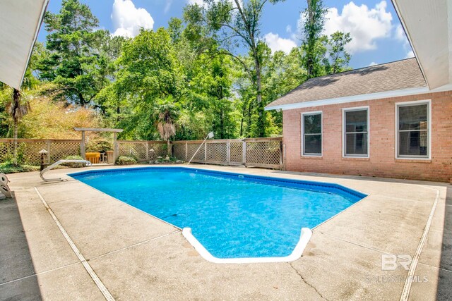 6805 Hunters Ct, Mobile, AL 36695 - view of pool featuring a patio and view of wooded area