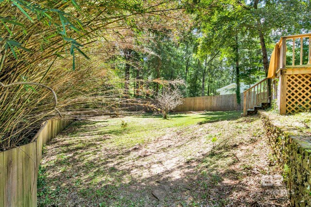 6805 Hunters Ct, Mobile, AL 36695 - fenced backyard featuring stairs