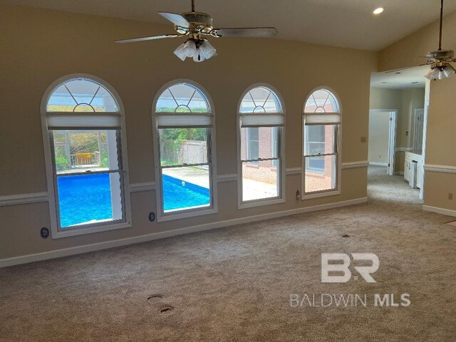 6805 Hunters Ct, Mobile, AL 36695 - spare room with a ceiling fan, carpet floors, vaulted ceiling, and baseboards