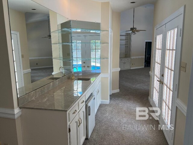 6805 Hunters Ct, Mobile, AL 36695 - bathroom featuring french doors, a sink, and healthy amount of natural light