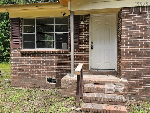 19930 Shepard Lake Rd, Mount Vernon, AL 36560 - view of exterior entry with brick siding and crawl space