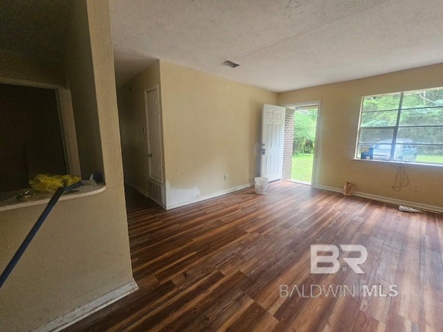 19930 Shepard Lake Rd, Mount Vernon, AL 36560 - spare room featuring wood finished floors and a textured ceiling