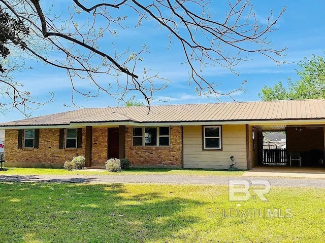 19483 Hughen St, Robertsdale, AL 36567 - ranch-style house featuring a front yard, a metal roof, and brick siding