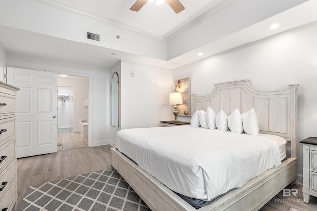 bedroom featuring a ceiling fan, visible vents, crown molding, wood finished floors, and recessed lighting