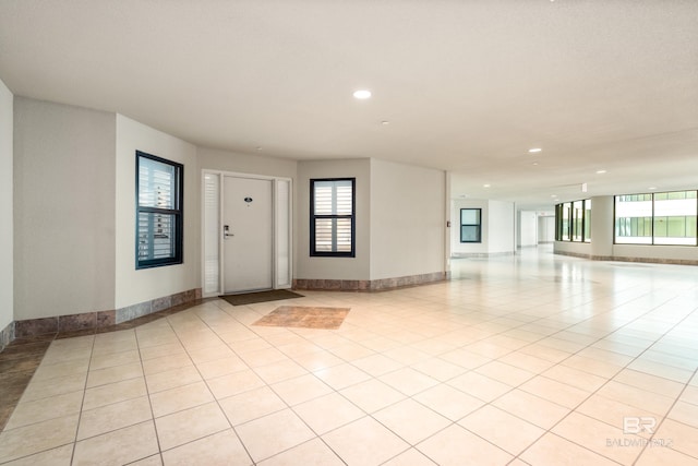 entrance foyer featuring plenty of natural light, recessed lighting, and light tile patterned flooring