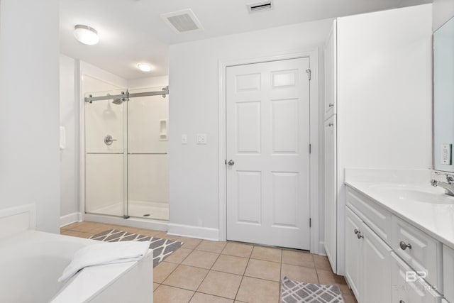 bathroom with vanity, tile patterned floors, a shower stall, and visible vents