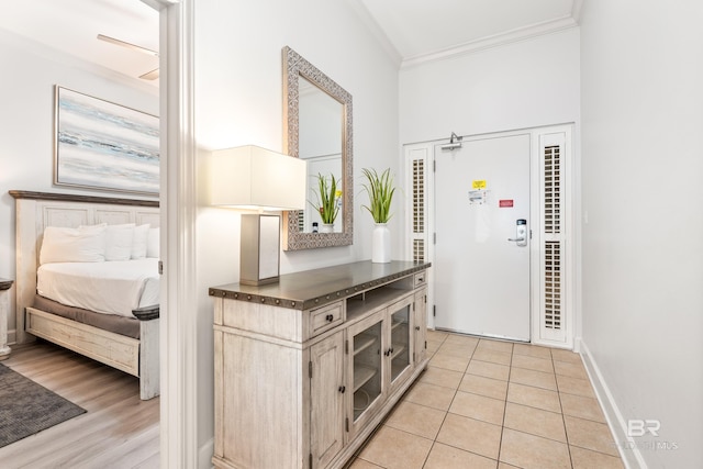 interior space featuring baseboards and ornamental molding