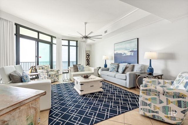 tiled living area featuring crown molding, a ceiling fan, and visible vents