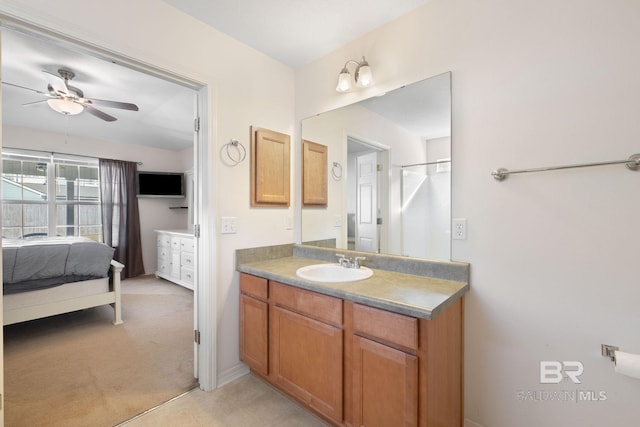 bathroom with ceiling fan and vanity