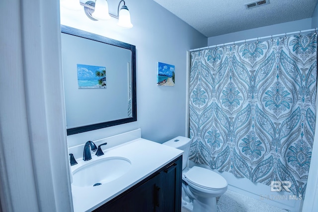 full bathroom with shower / tub combo, vanity, a textured ceiling, and toilet