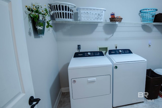 washroom with washing machine and dryer