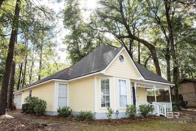 view of front of property with central AC unit and a porch