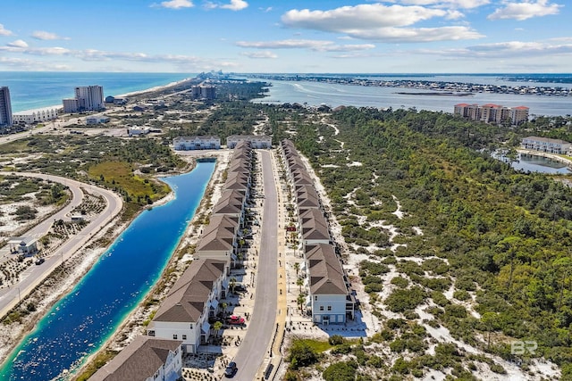 drone / aerial view featuring a beach view and a water view