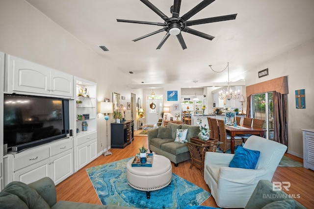 11346 County Road 99, Lillian, AL 36549 - living area featuring ceiling fan, a chandelier, and light wood-style floors